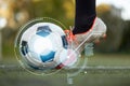 Soccer player playing with ball on football field Royalty Free Stock Photo