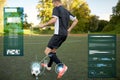 Soccer player playing with ball on football field Royalty Free Stock Photo