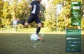 Soccer player playing with ball on football field Royalty Free Stock Photo