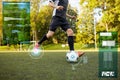 Soccer player playing with ball on football field Royalty Free Stock Photo