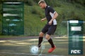 Soccer player playing with ball on football field Royalty Free Stock Photo