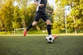 Soccer player playing with ball on football field Royalty Free Stock Photo