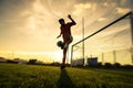 Soccer player is training alone at the stadium at sunset - Concept about soccer, sport, and lifestyle Royalty Free Stock Photo