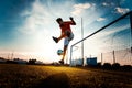 Soccer player is training alone at the stadium at sunset - Concept about soccer, sport, and lifestyle Royalty Free Stock Photo