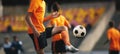 Soccer Player on Training with Ball. Young Football Athlete Kicking Ball. Soccer Tram Practice Session. Blurred Sports Stadium Royalty Free Stock Photo