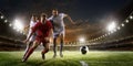 Soccer players in action on sunset stadium background panorama Royalty Free Stock Photo