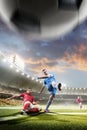 Soccer players in action on sunset stadium background Royalty Free Stock Photo