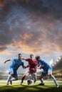 Soccer players in action on sunset stadium background Royalty Free Stock Photo