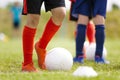 Soccer Players Kicking Classic White Soccer Balls on Training Session. Youth Football Background