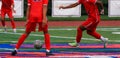 Soccer players passing the ball during a game