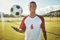 Soccer, portrait and man on a field for training, sports or game in summer. Happy, excited and young athlete catching a