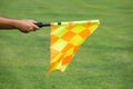 Soccer referee hold the flag. Offside trap Royalty Free Stock Photo