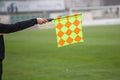 Soccer referee hold the flag. Offside trap Royalty Free Stock Photo