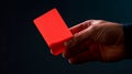 A soccer referee holding a red card. Generative AI. Royalty Free Stock Photo