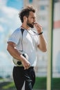 Soccer referee whistling in whistle on soccer pitch during game Royalty Free Stock Photo