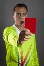 Soccer referee in yellow shirt showing the red card Royalty Free Stock Photo