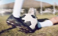 Soccer, shoes and ball with motion blur, fitness on sports field, action and speed, tackle and training outdoor Royalty Free Stock Photo