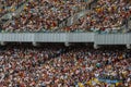 Soccer stadium inside view. football field, empty stands, a crowd of fans, a roof against the sky