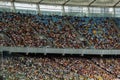 Soccer stadium inside view. football field, empty stands, a crowd of fans, a roof against the sky