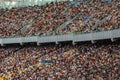 Soccer stadium inside view. football field, empty stands, a crowd of fans, a roof against the sky