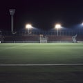 soccer stadium at night empty with lights on Royalty Free Stock Photo