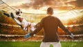 Soccer striker hits the ball with an acrobatic kick in the air at the stadium Royalty Free Stock Photo