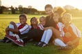 Soccer, team and children on sports field with coach for training, football event or learning sport. Portrait of teacher