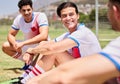 Soccer, team and men talking, smile and talk after game, training and practice outdoor on a field or pitch. Football Royalty Free Stock Photo