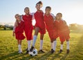 Soccer, team sports and portrait of children training for football game on a grass field together. Happy, smile and Royalty Free Stock Photo