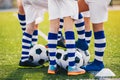 Soccer Team on Training. Legs of Group of Young Football Players on Training Field on Summer Day Royalty Free Stock Photo