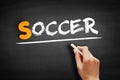 Soccer text on blackboard Royalty Free Stock Photo