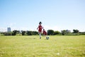 Soccer, training or children and a girl team playing with a ball together on a field for practice. Fitness, football and Royalty Free Stock Photo