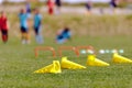 Soccer training equipment lying on grass turf training pitch Royalty Free Stock Photo