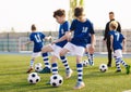 Soccer Training Exercises for Kids. Boys Training with Balls on Summer Football Grass Field Royalty Free Stock Photo