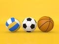 Soccer volleyball and basketballs on a yellow background.