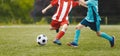 Soccer Youth Teams Play Outdoor Tournament. Soccer Stadium in the Background. Young Soccer Players Competition Royalty Free Stock Photo