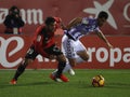 Soccers players during a football match between Real Valladolid and Real Mallorca in the stadium of Son Moix. Royalty Free Stock Photo