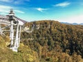 Russia, Sochi best holidays. Beautiful view of the hills, mountains covered with autumn forest. Skypark metal bridge. Skybridge Royalty Free Stock Photo