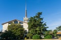 Sochi Commercial Sea Port with spire. Evergreen Magnolia Grandiflora and huge Himalayan ÃÂ¡edar