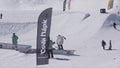 SOCHI, RUSSIA - APRIL 2, 2016: Skier backslide on rail. Ski resort. Sunny. Extreme stunts. Active sport.