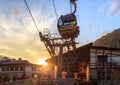 Sochi, Russia - August 8, 2013: Cableway gondola ski lift lower station in Rosa Khutor mountain resort at sunset in summer. Scenic