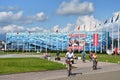 Sochi, Russia, August, 10, 2019. People on bicycles riding in front of the ice palace `Iceberg` in the summer. Sochi, Adler, Olymp