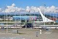 Sochi, Russia, August, 10, 2019. People walking in Sochi Olympic Park. Fountain `Olympic torch` and the ice palace `Iceberg` in th