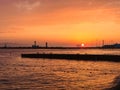 The Symbol of the Olympics - Rings and the Lighthouse in the Sea Against the Sunset