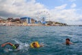 teenage boys and grandma swim in the sea