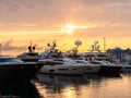 Yachts at the pier in the seaport at sunset Royalty Free Stock Photo