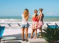 Sochi, Russia - August, 05, 2019. Young girls look at stormy Black sea