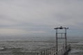 Sochi, Russia 05.07.2021. Breakwater pier summer black sea cloudy Royalty Free Stock Photo