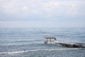 Sochi, Russia 05.07.2021. Breakwater pier summer black sea cloudy Royalty Free Stock Photo