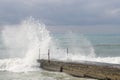 Sochi, Russia 05.07.2021. Breakwater pier summer black sea cloudy Royalty Free Stock Photo